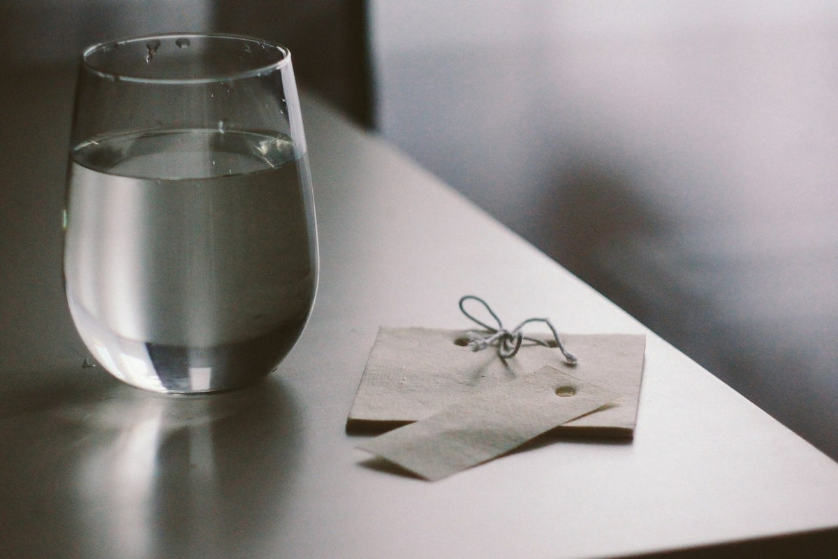A glass of water on a pale surface