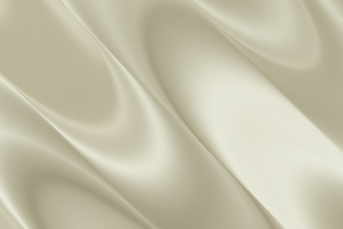 Soft folds of cream silk fabric
